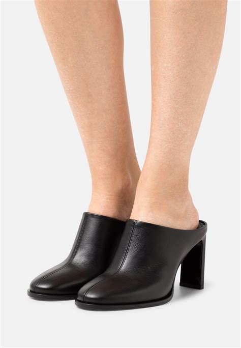 calvin klein heeled mules black.